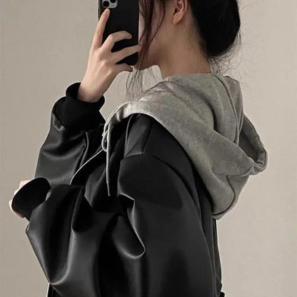 Chaqueta coreana de cuero PU negro de gama alta para mujer, moda holgada con capucha para primavera y otoño, ropa de abrigo versátil falsa de dos piezas con cremallera