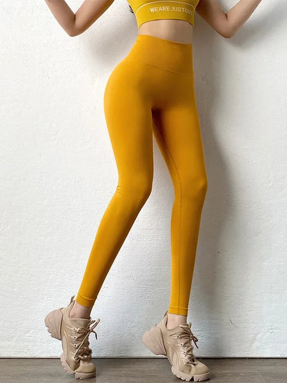 Mallas ajustadas sin costuras para mujer, mallas sólidas de cintura alta, mallas elásticas para Fitness y Yoga, pantalones de entrenamiento de gimnasio a la moda de punto con realce en el trasero